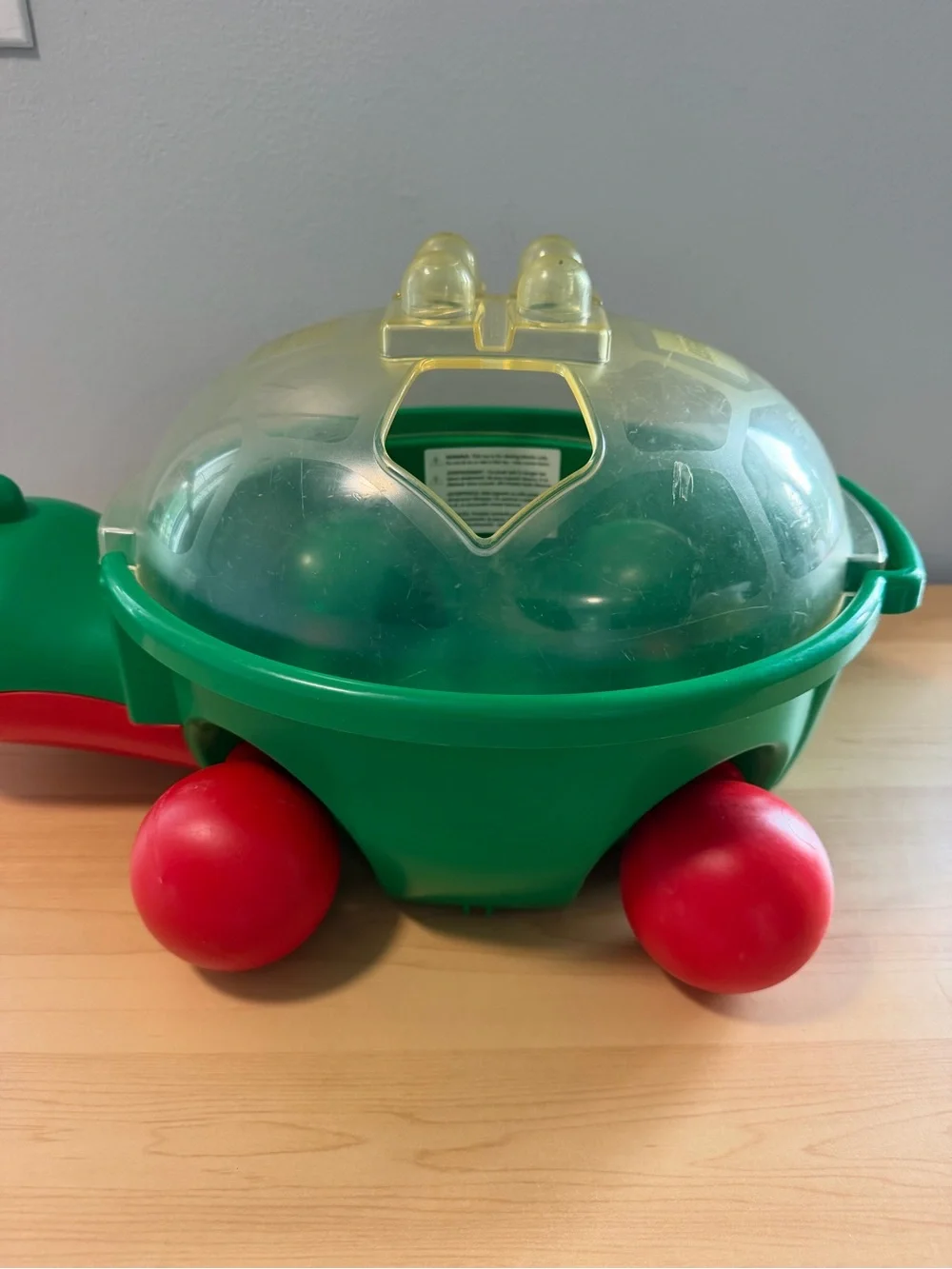 Lego Baby Green Turtle Walker Ride-On with Red Wheels and Translucent Shell
